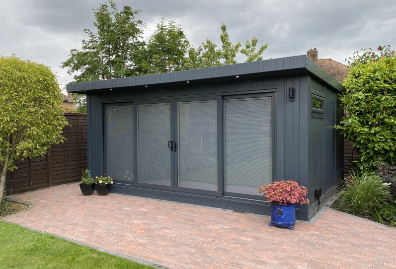 garden summer house  with integrated blinds shut Kent