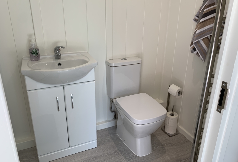 Aluminium in-line slider with canopy and hot tub featuring 'Starlight Ceiling' West Sussex Internal Bathroom