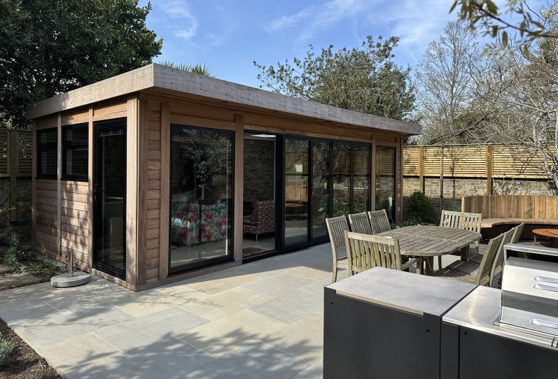 Bespoke Garden Room with Iroko Cladding and Bi-Folding Doors in London
