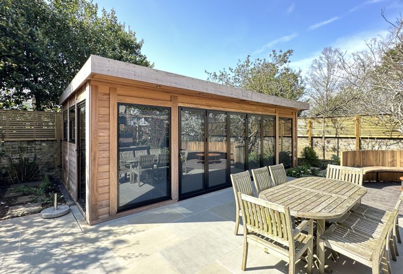 Bespoke Garden Room with Iroko Cladding and Bi-Folding Doors in London