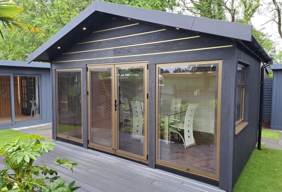 Millboard Envello cladding and gold decor inserts by BAkers garden Buildings