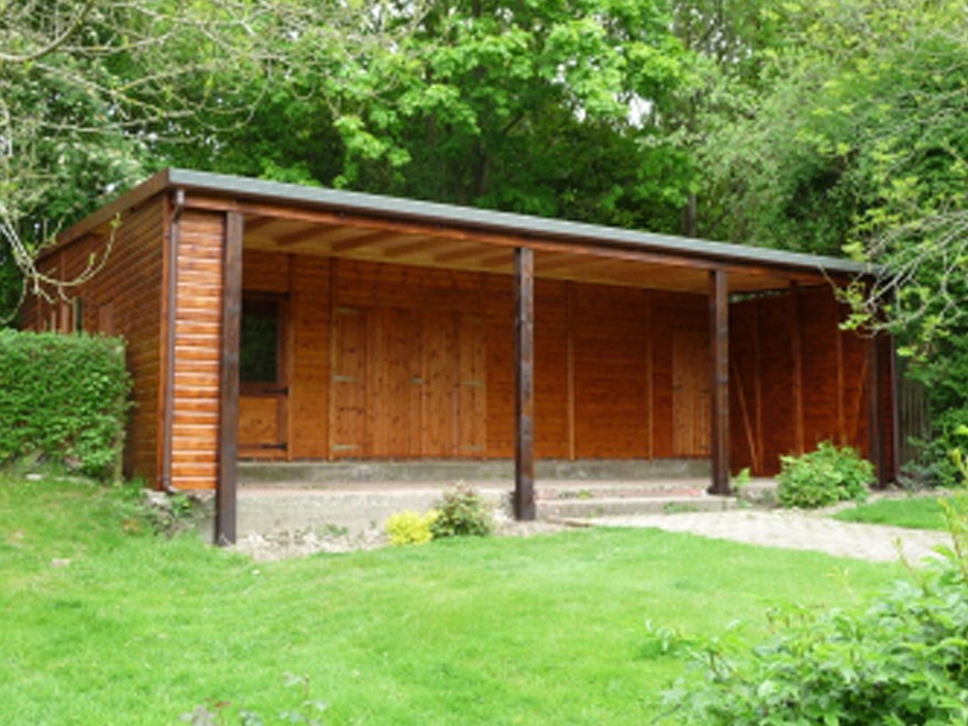Rear of Albatross garage with integrated summerhouse and canopy