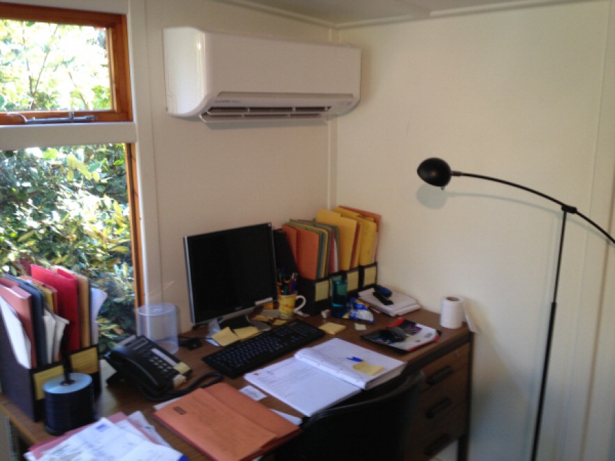 Desk with climate control unit above
