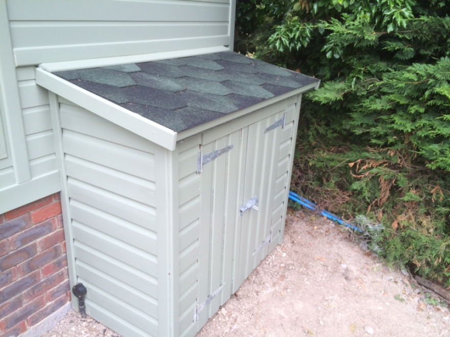 Pool pump unit perfectly matched to building and also featuring our felt shingle roof tiles
