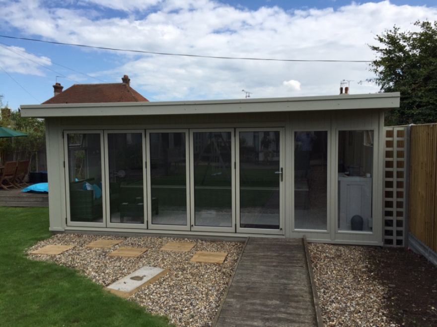 This impressive summer house has been painted with Sadolin Superdec in RAL 7032 'Pebble Grey'
