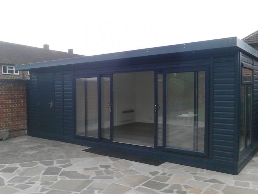 4,2m wide 4 pane UPVC sliding doors colour matched precisely to the building's cladding