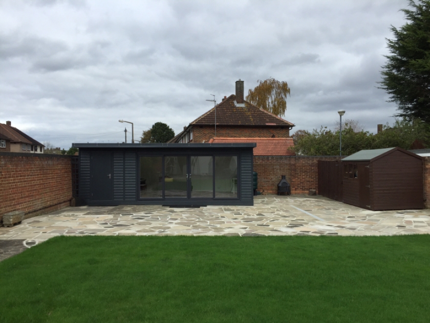 Stunning garden room with UPVC sliding doors precisely colour matched to the exterior timber cladding