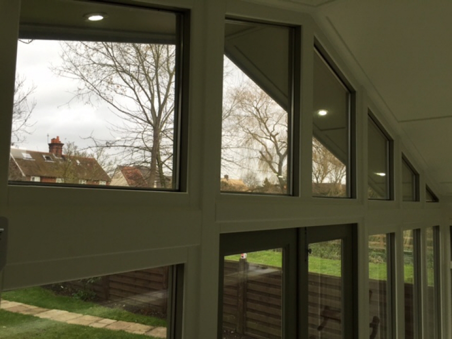 Stylish LED downlights seen through the gabled glass