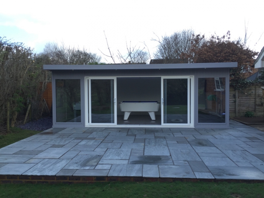 Games room with white doors contrasting the RAL 7004 external cladding