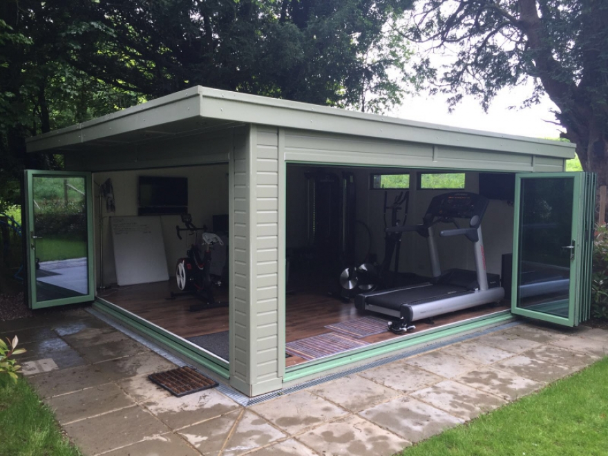 This home gym is the first of its kind featuring 2 sets of aluminium bi-folding doors for unbeatable opening and integration with the outside