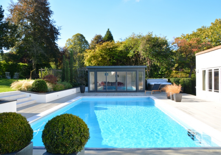This sleek and contemporary room sits beautifully within the customer's delightful, landscaped garden.