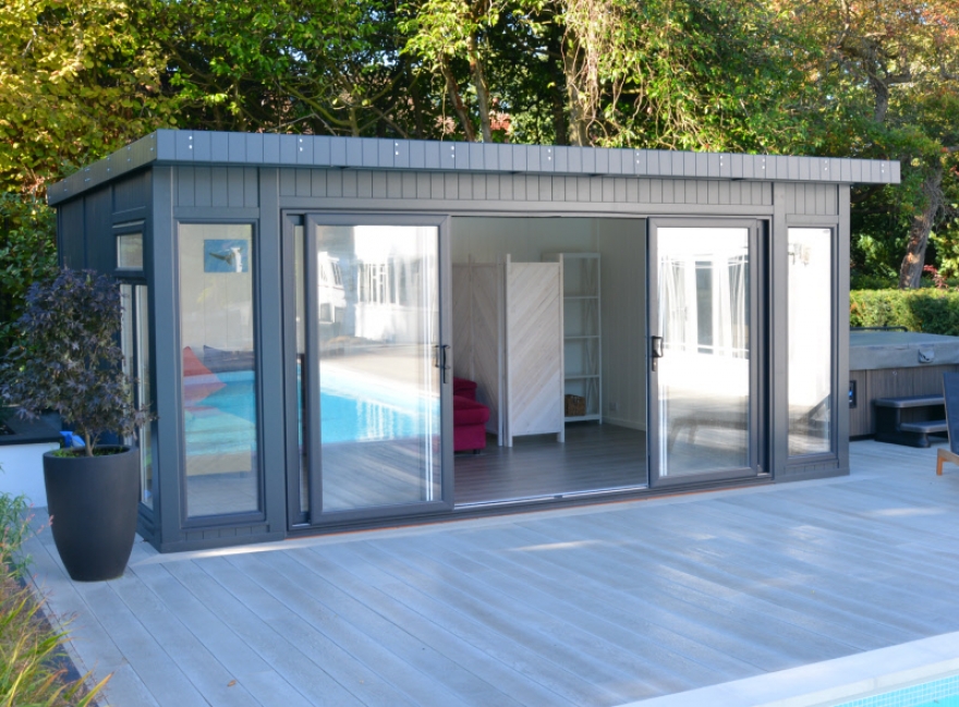 The sleek contemporary room is surrounded by practical decking