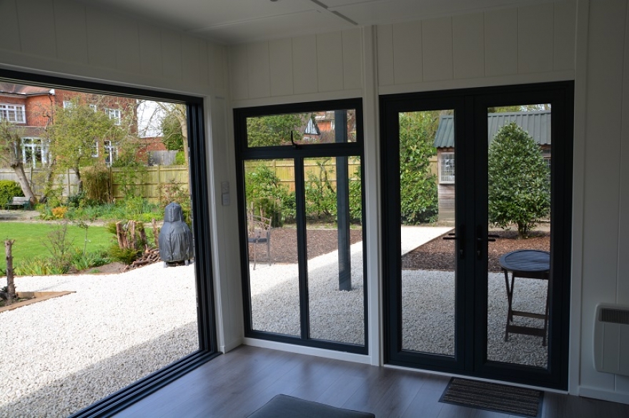 Our client chose to have french doors opening out into the overhang area, allowing full flexibility of the use of space