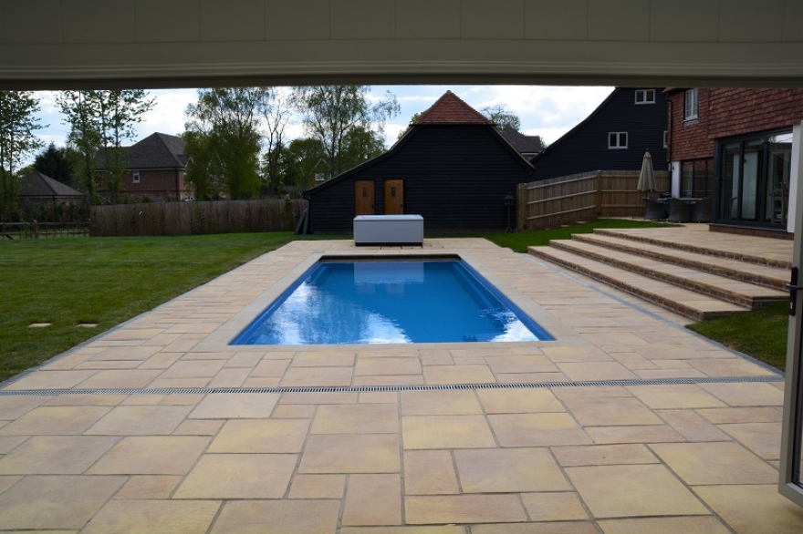 view of the stunning 'Compass' pool with Villeroy & Boch 'just silence' hot tub beyond