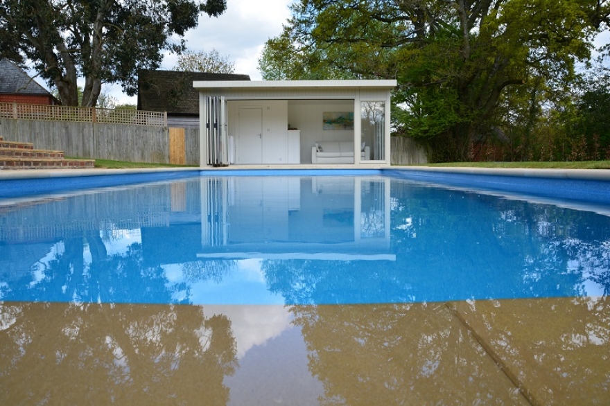 View of the poolside summerhouse from the stunning 'Compass' pool.