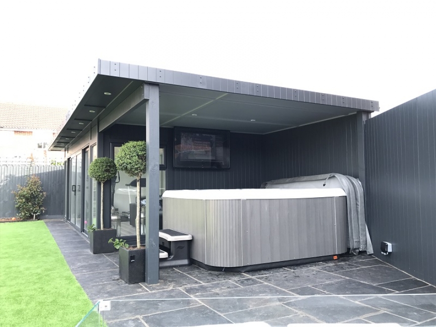 The large canopy completely covers the client's hot tub, allowing them to use it all year round