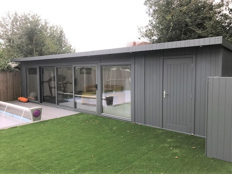 This multipurpose poolside garden room in Surrey is finished in Basalt Grey