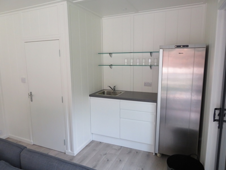 self-contained with kitchen area 