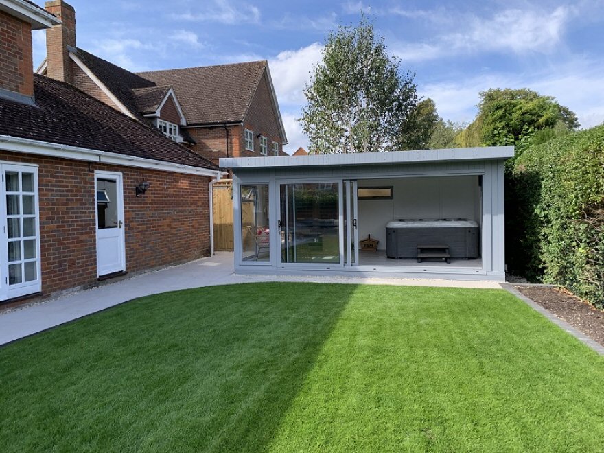 This stunning contemporary pent garden room measures 5.45m x 4m, with tri-sliding doors for hot-tub access