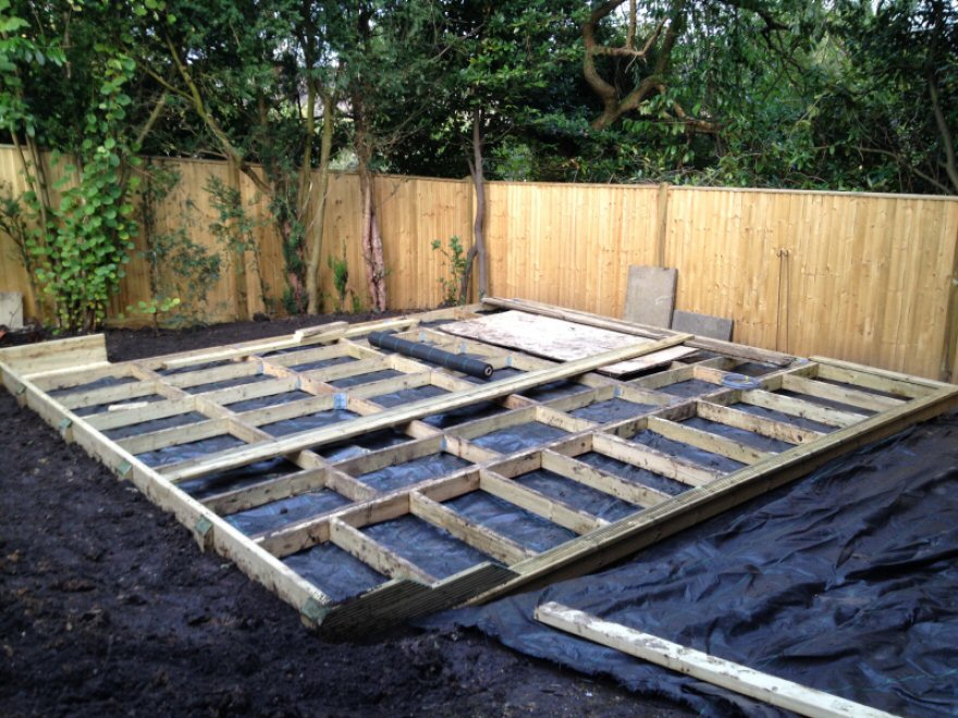 Base with digout and retaining wall & weed membrane