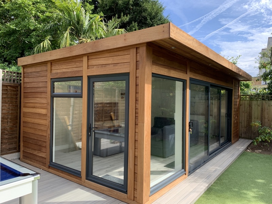 Beautiful New Concept Building/Man Cave With Aluminium Doors and Windows in RAL 7016 Anthracite with Hardwood Iroko Cladding Installed in Wimbledon