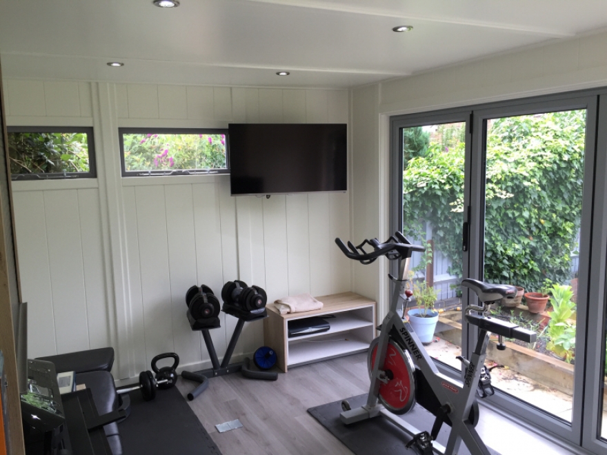 Executive combination home office & gym with separate storage section