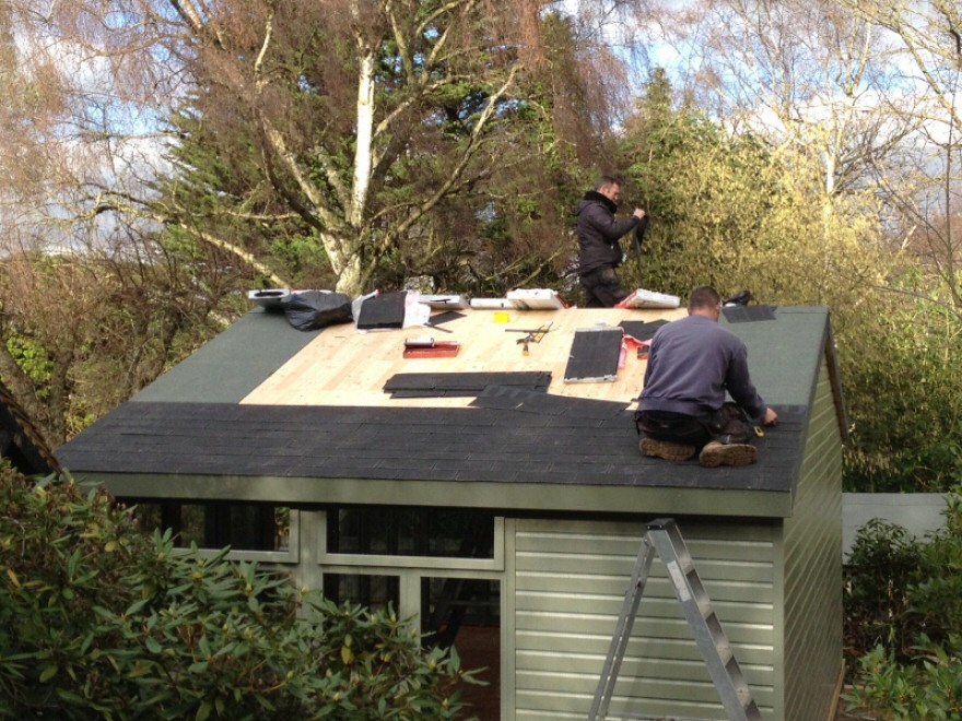 Slate effect shingles being fitted