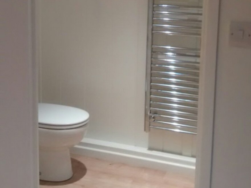 Fully equipped bathroom featuring toilet, wash basin and walk-in shower
