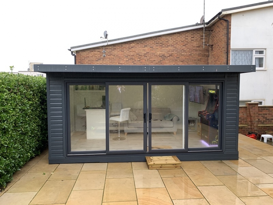 Garden Room with Bar, TV and Arcade Machine with RAL7016 UPVC Sliding Doors and Matching Windows Installed in Saltdean East Sussex