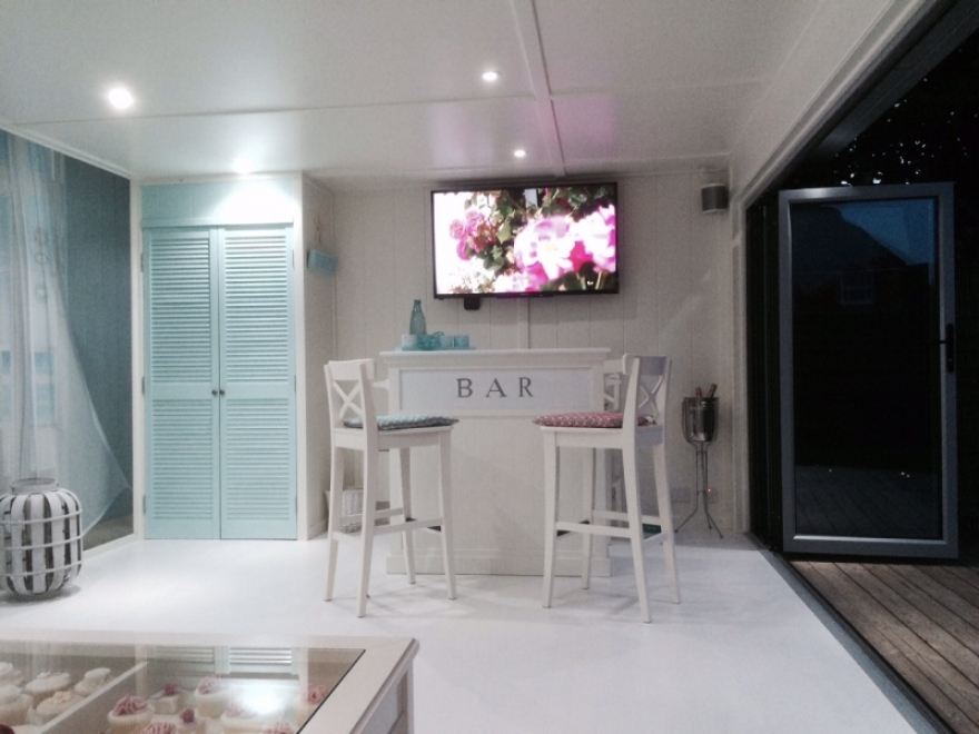 Inside a garden room with Sky TV, and Sonos speakers 