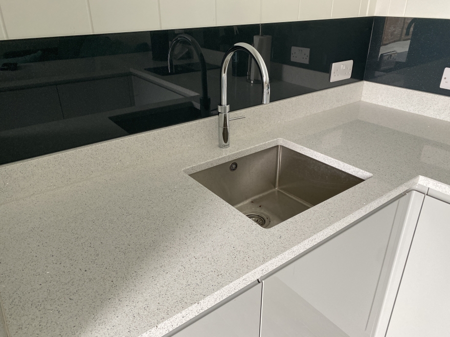Quooker tap with Hot, Cold and sparkling water with glass and glitter splashback 