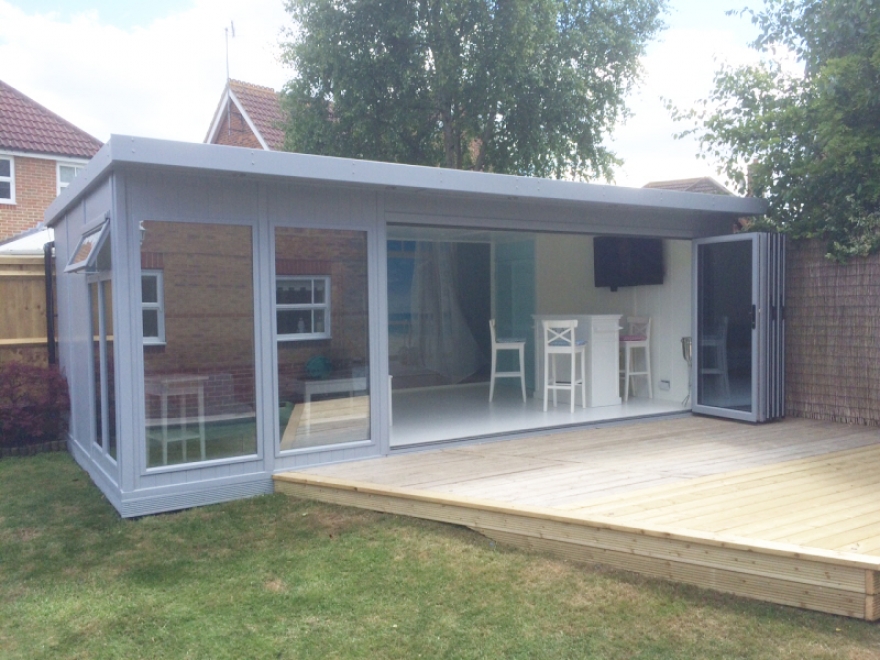 This building is painted in Sadolin Superdec RAL 7040 'Window Grey' and has perfectly matched aluminium bi-folding doors 