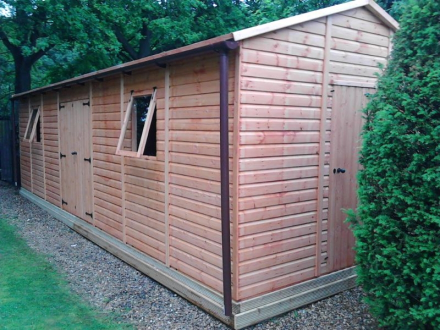 This impressive Raven Workshop in Horley comes lined, insulated and double glazed to eliminate any risk of condensation. Wooden workshops uk by Bakers Garden Buildings.