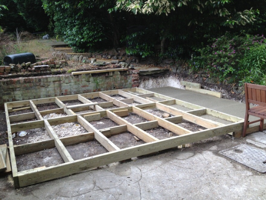 Timber frame base on concrete with patio sub-base to front