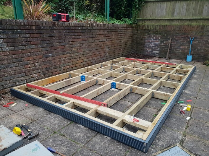 Timber frame with stub steels that are sitting on firm but not level base
