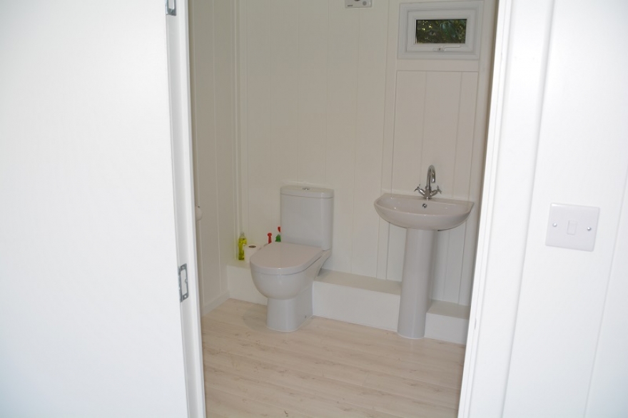 toilet in summer house next to pool 