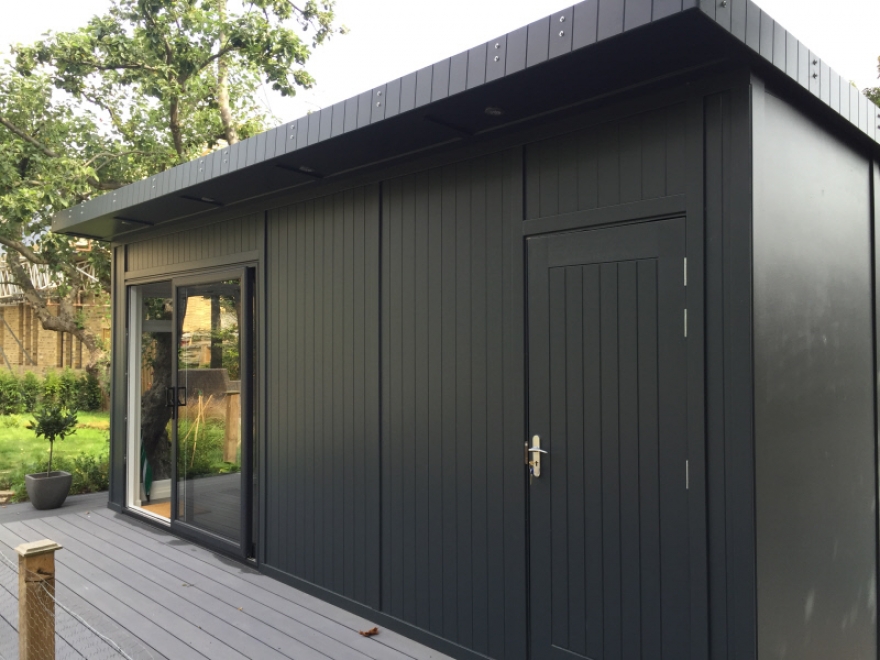 "V-100" tricoya cladding painted in Sadolin Superdec Anthracite with fire/zero maintenance wall to one side