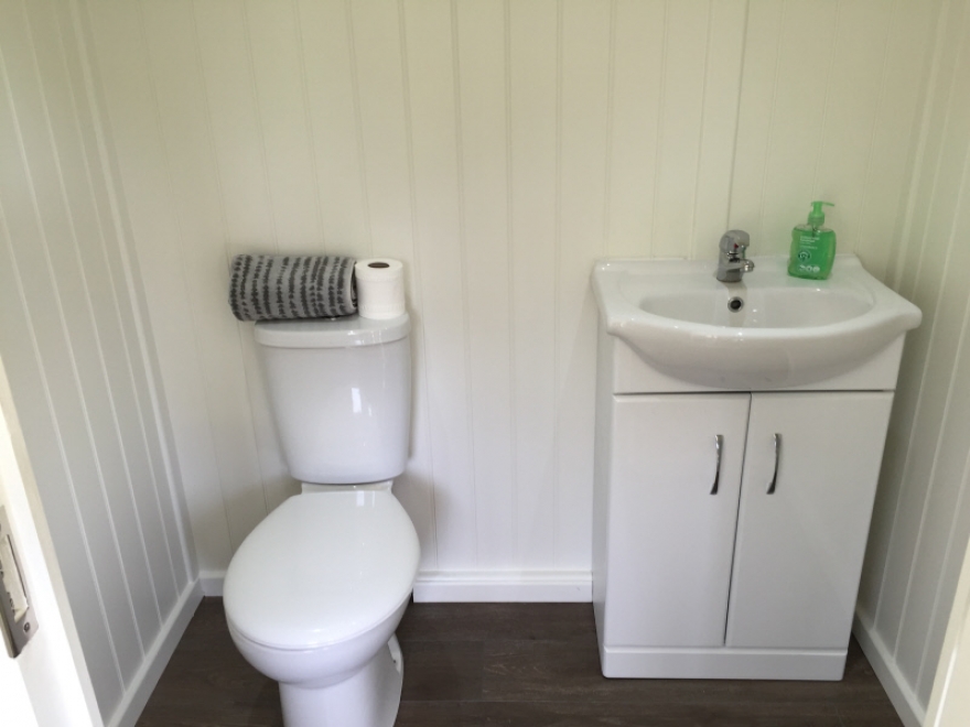 W.C with attractive sink unit with hot and cold water flow