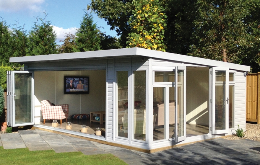 With the front and side doors open the garden room feels fully integrated with the outdoor entrainments area