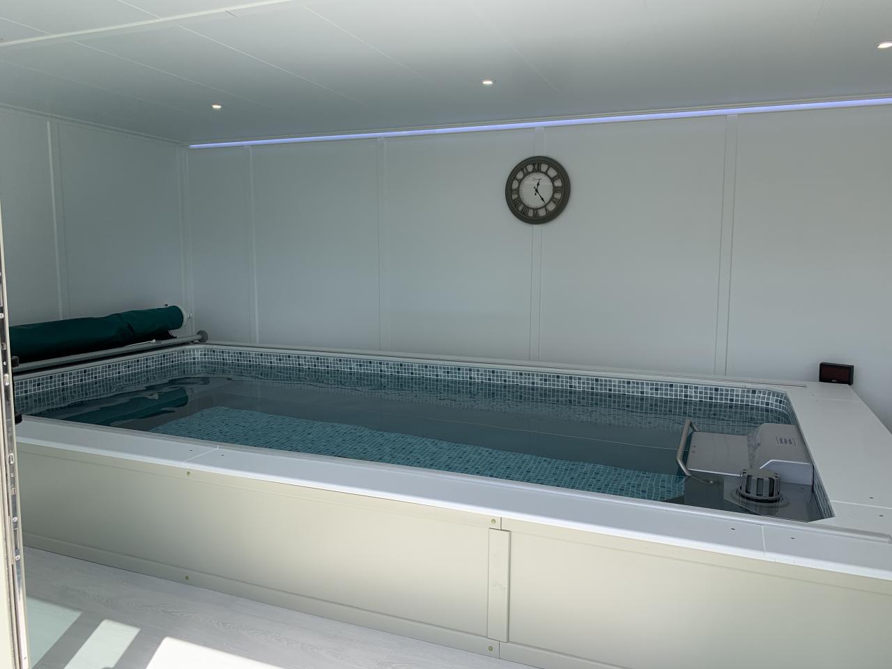 This Endless pool room with side canopy for a Hot-tub offers so much for the user, beautifully finished with some great features throughout. 
In the client's words:
Finding a suitable building to house an Endless Pool had proved very difficult, until we came across Bakers and visited their show buildings at Haywards Heath.
Martin Baker showed us round and explained the pros and cons of all the buildings and options - no hard sell, just a pleasant chat.
We were sold and haven't been disappointed with the resulting build and building.
Lovely people, great product. Highly Recommended